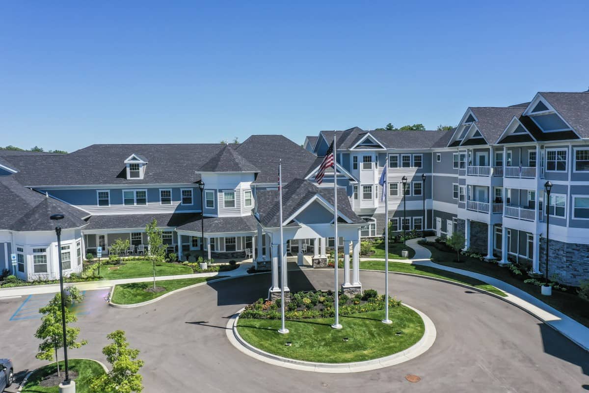 Aerial view of the Quincy Place Senior Living parking lot and main building